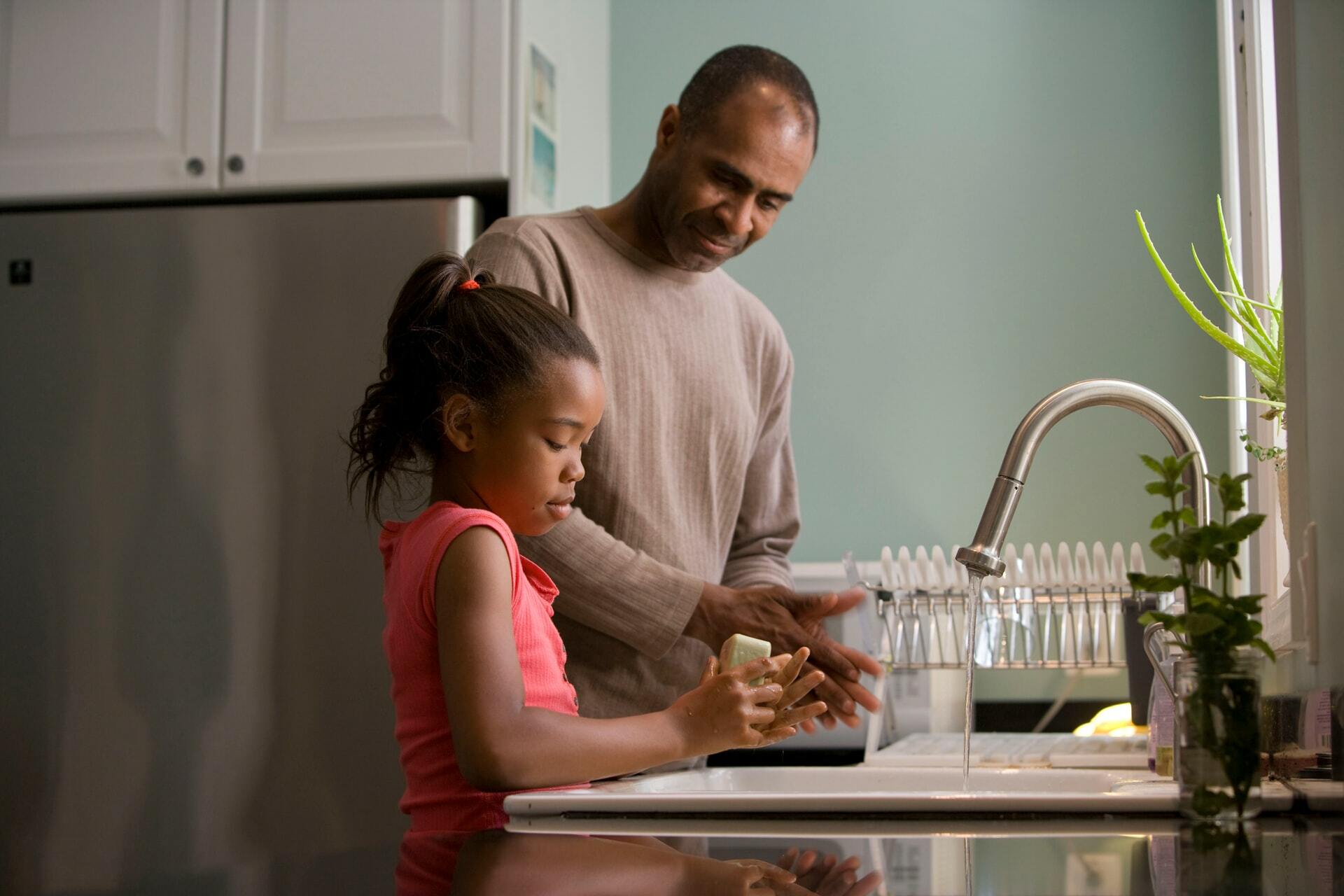 a man and a woman in a kitchen