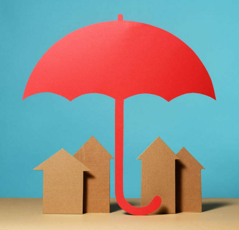 WOODEN BLOCK HOUSES RED UMBRELLA OVER IT